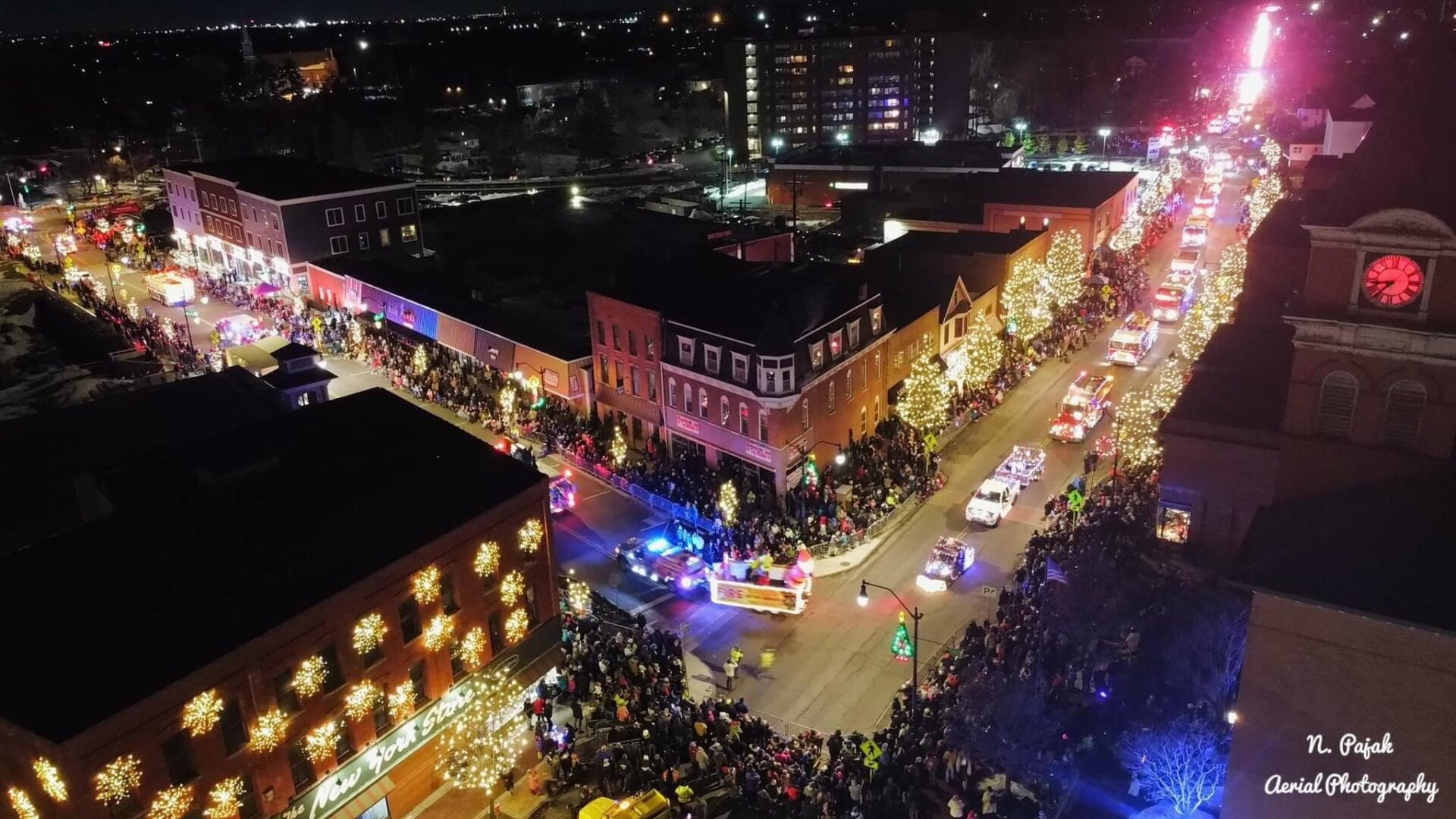 Festive night parade with crowds